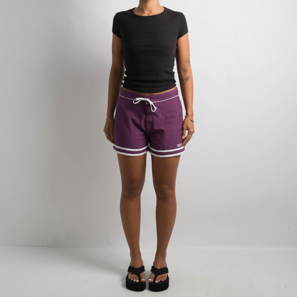 PURPLE MINI BOARD SHORTS